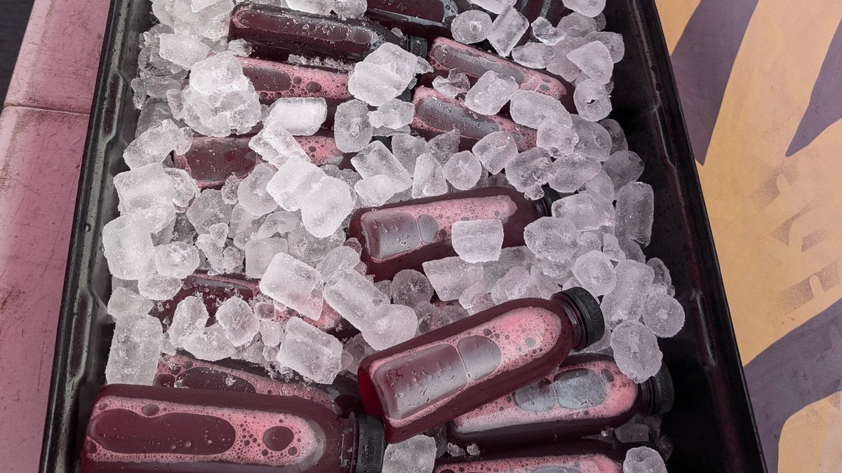 Bottles of Karkade hibiscus drink packed in ice