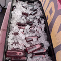 Bottles of Karkade hibiscus drink packed in ice